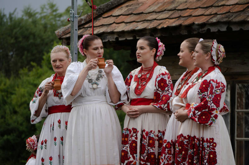 a-group-of-women-standing-next-to-each-other-tradition-in-croatia