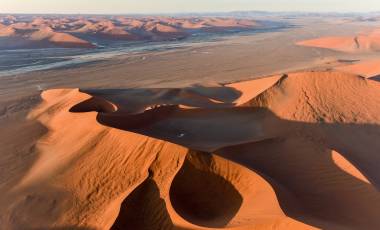 Aerial view of high red dunes, located in the Namib Desert, in the Namib-Naukluft National Park of Namibia, Africa