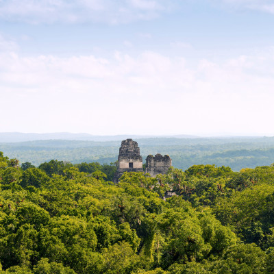 Mayan ruins rise above the jungle in the famous Tikal National Park, Guatemala