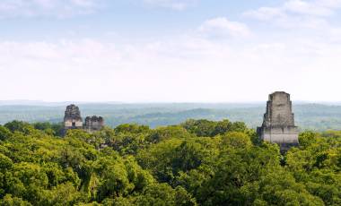 Mayan ruins rise above the jungle in the famous Tikal National Park, Guatemala