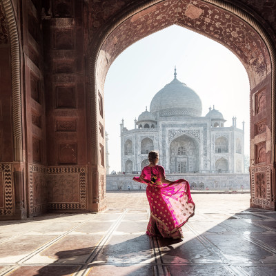 Lady standing near Taj Mahal, Agra, India - Best Time to Visit India