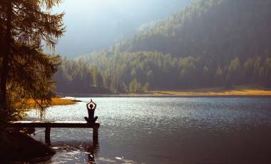 Meditation and yoga practicing at sunset