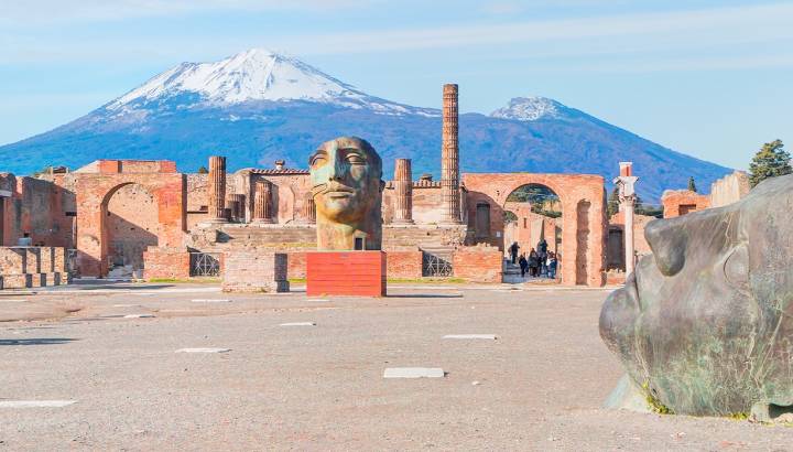 Enchanting Travels Italy Tours Ancient Roman city of Pompeii against Vesuvius volcano