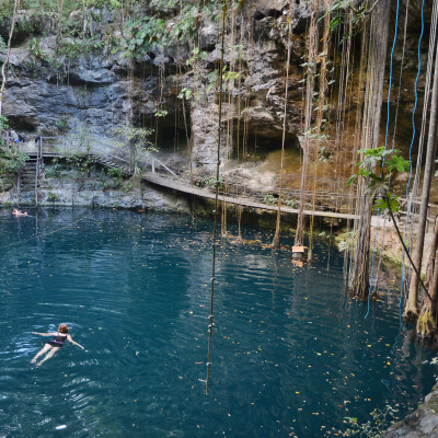 Swimmeres in X-Canche cenote in Yucatan peninsula, Mexico, Central America