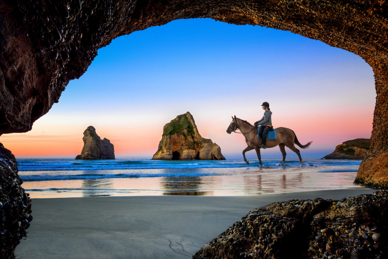 Enchanting-Travels-New-Zealand-tours-view-from-the-cave-of-Wharariki-Beach