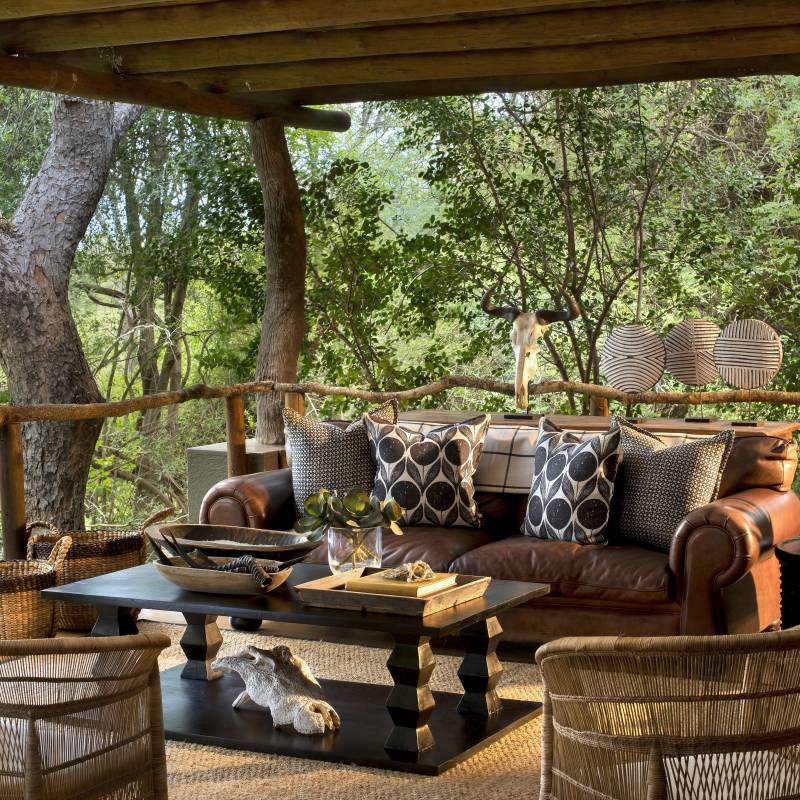 Outdoor lounge area at Lion Sands Tinga Lodge Hotel, South Kruger in South Africa