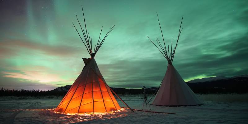 Indian Tipies under the northern lights in Whitehorse, Yukon