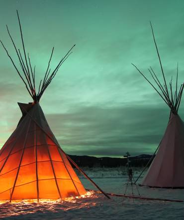 Indian Tipies under the northern lights in Whitehorse, Yukon