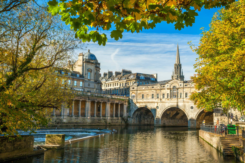 View of Pulteney Bridge seen across the River Avon on a tour of the United Kingdom and ireland