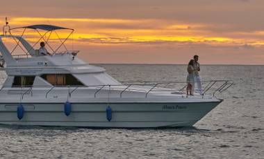 Couples enjoying in cruise during sunset