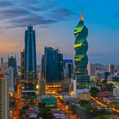The colorful panoramic skyline of Panama City at sunset with high rise skyscrapers, Panama, Central America.