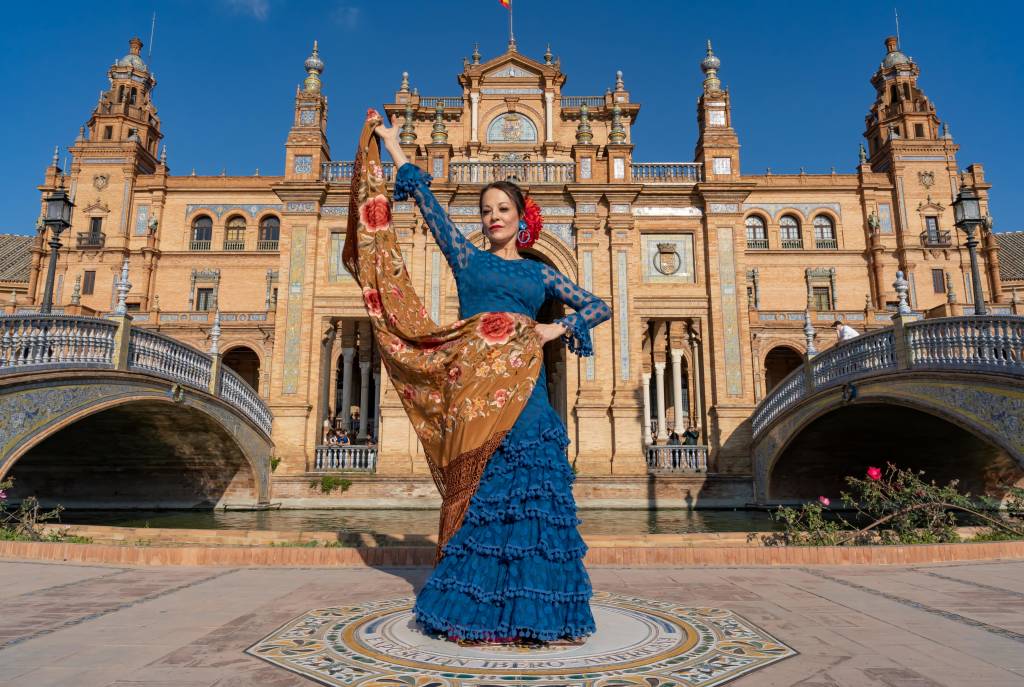 Typical Spanish woman dancing flamenco in Seville, Andalusia, Spain.-min